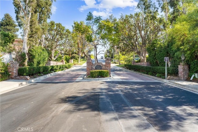 view of road with curbs