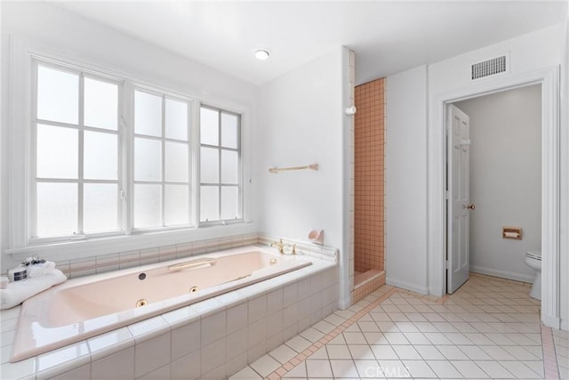 full bathroom featuring visible vents, a shower stall, a jetted tub, toilet, and tile patterned floors