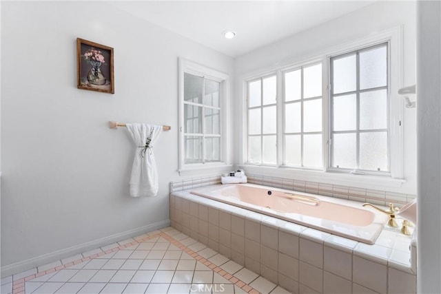 bathroom featuring tiled bath and tile patterned floors