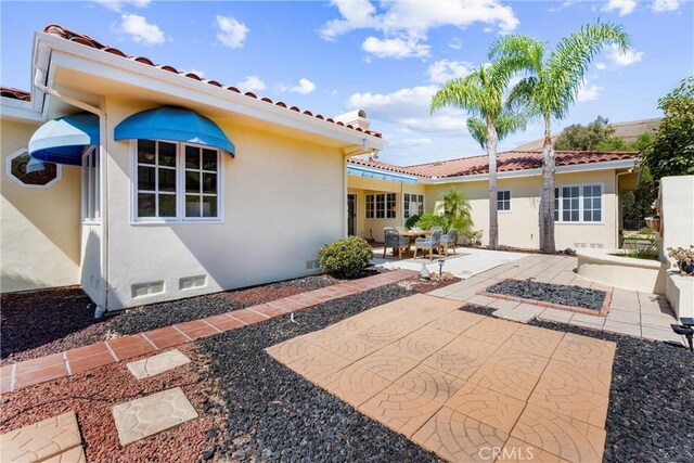 back of property with a patio area