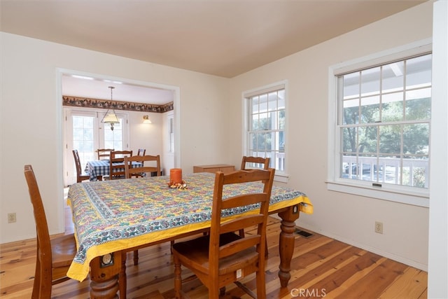 dining space featuring hardwood / wood-style floors