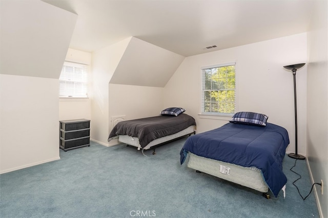 carpeted bedroom with vaulted ceiling