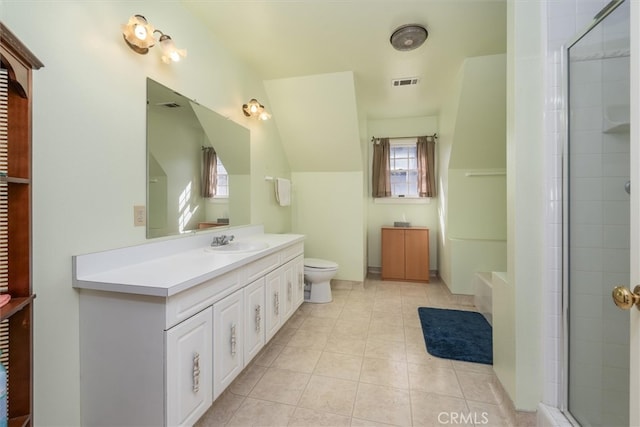 bathroom featuring vanity, toilet, an enclosed shower, and tile patterned floors