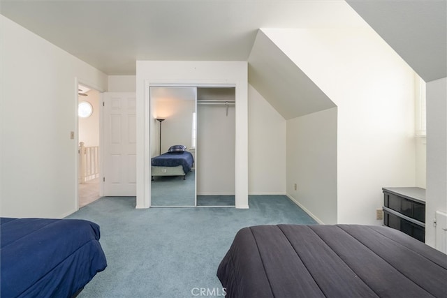 bedroom featuring light carpet and a closet