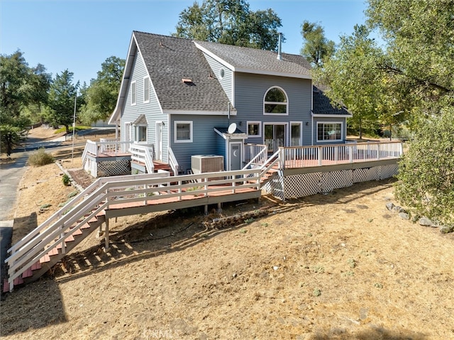 back of property with a wooden deck