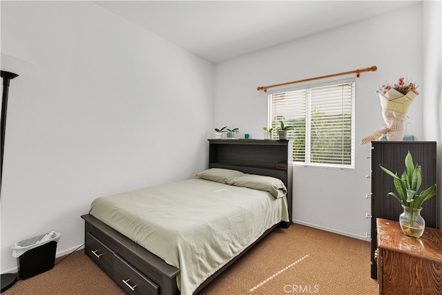 bedroom featuring light carpet