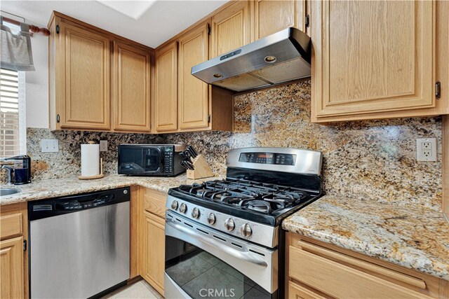 kitchen featuring decorative backsplash, light stone countertops, light tile patterned floors, stainless steel appliances, and ventilation hood