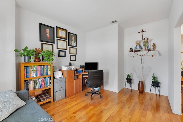 home office featuring light hardwood / wood-style floors