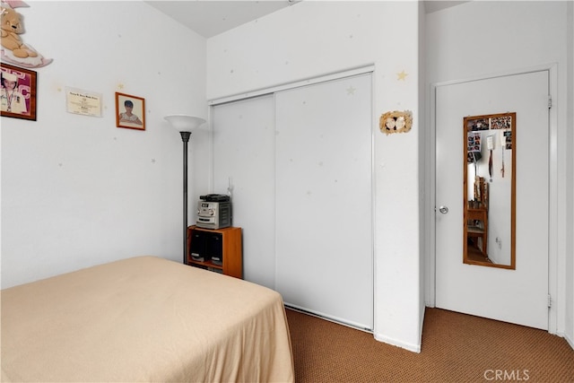 carpeted bedroom with a closet