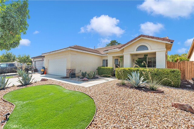 view of front facade featuring a front yard and a garage