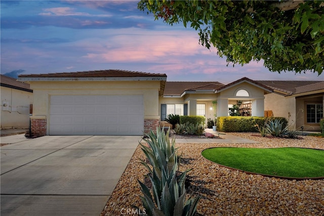 ranch-style house featuring a garage