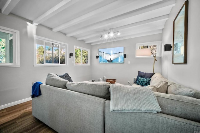 living room featuring beamed ceiling and dark hardwood / wood-style floors