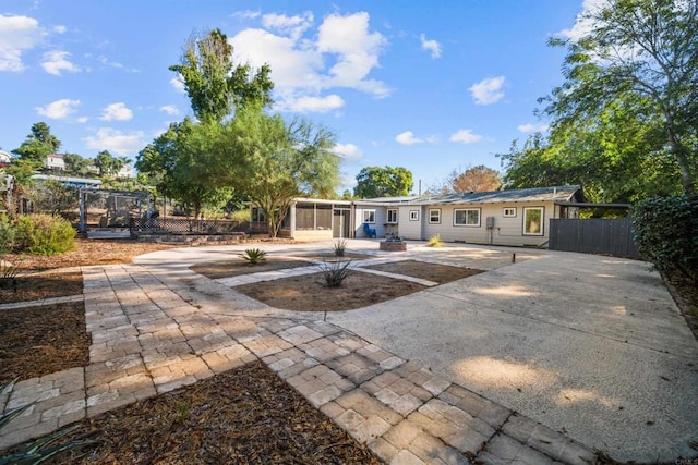 view of patio / terrace featuring a sunroom