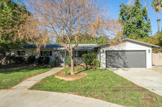 ranch-style home with a front yard and a garage