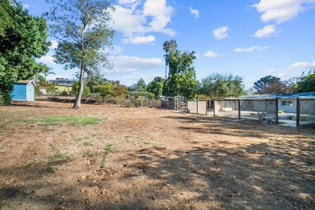 view of yard with a storage unit