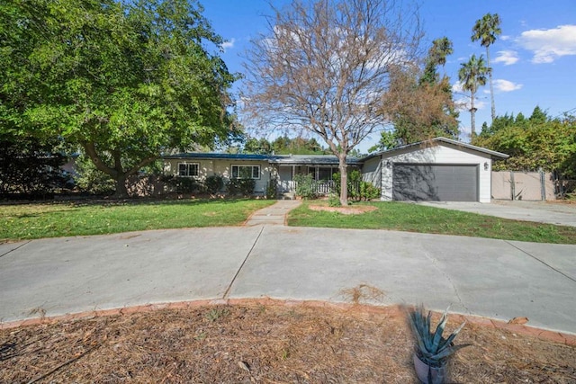 ranch-style home with a front lawn and a garage