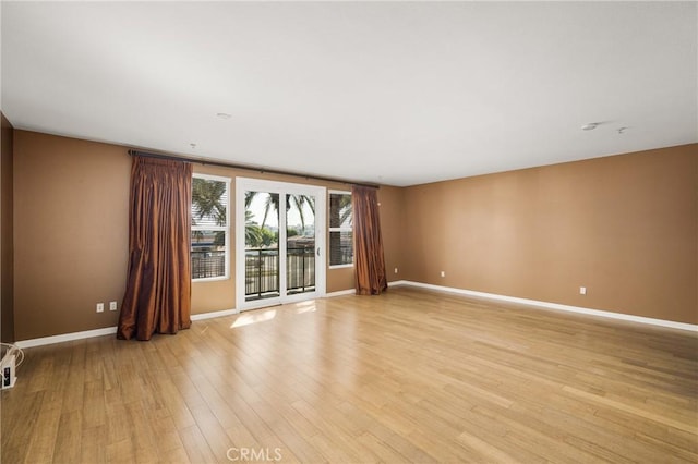 unfurnished room featuring light wood-type flooring