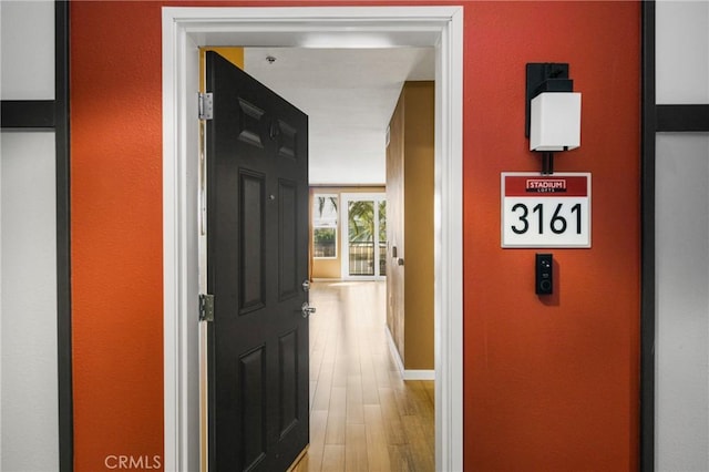 hallway with wood finished floors