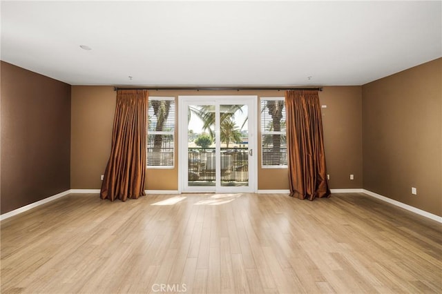 unfurnished room featuring light wood-type flooring