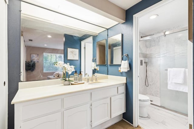 bathroom featuring walk in shower, vanity, and toilet