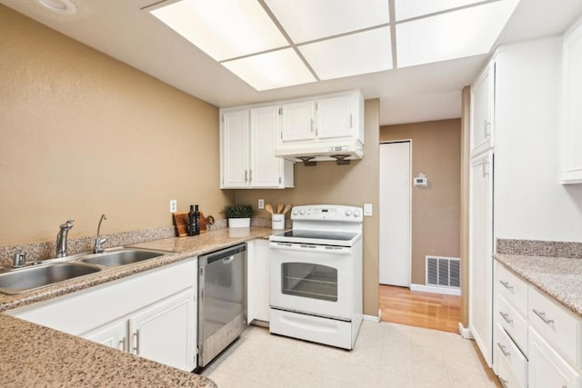 kitchen featuring stainless steel dishwasher, white range with electric cooktop, sink, and white cabinetry