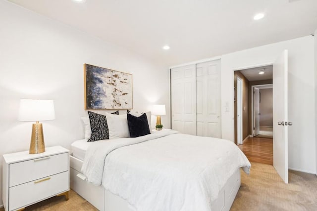 carpeted bedroom featuring a closet