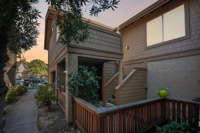 view of exterior entry at dusk