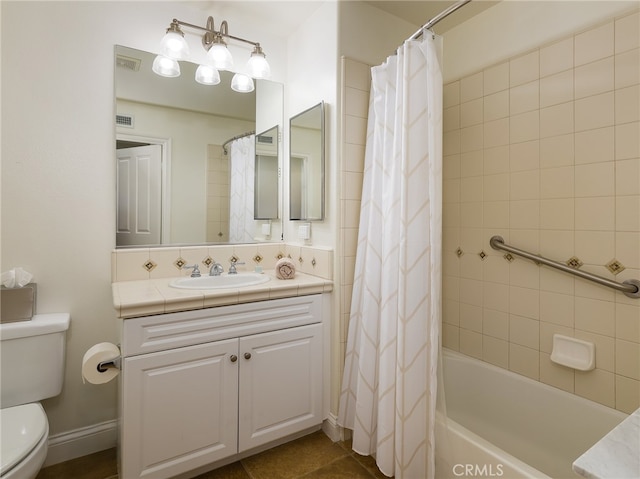 full bathroom featuring vanity, tile patterned flooring, toilet, and shower / bathtub combination with curtain