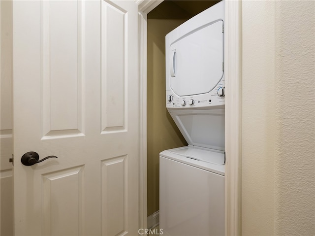 laundry room featuring stacked washer and dryer