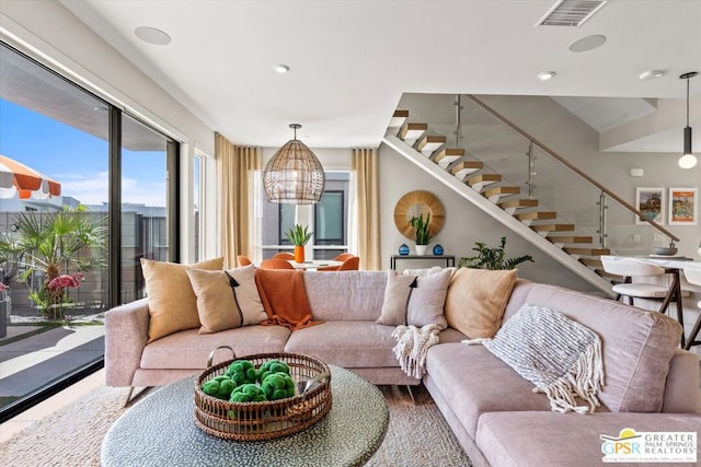 living room featuring a notable chandelier