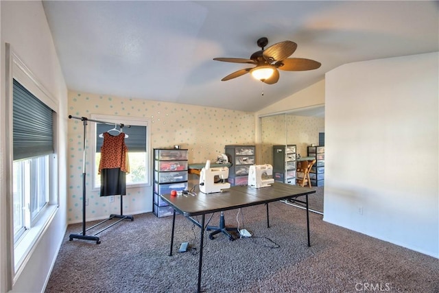 office space featuring carpet flooring, vaulted ceiling, and ceiling fan