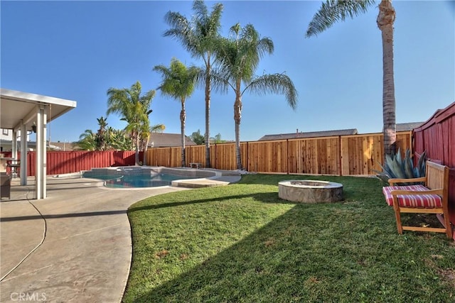 view of yard featuring a fenced in pool and a patio area