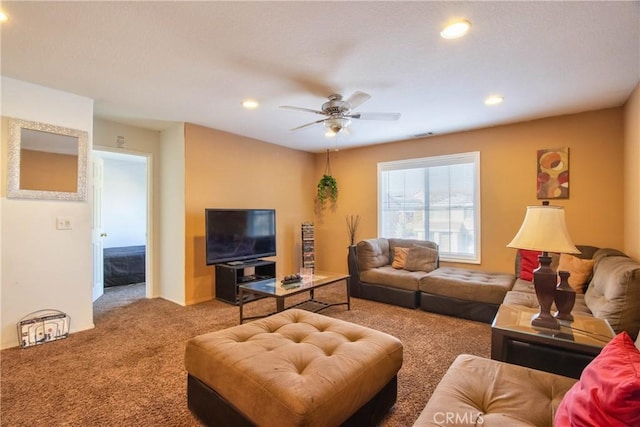 carpeted living room featuring ceiling fan