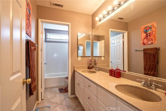 full bathroom featuring tile patterned flooring, vanity, toilet, and shower / washtub combination