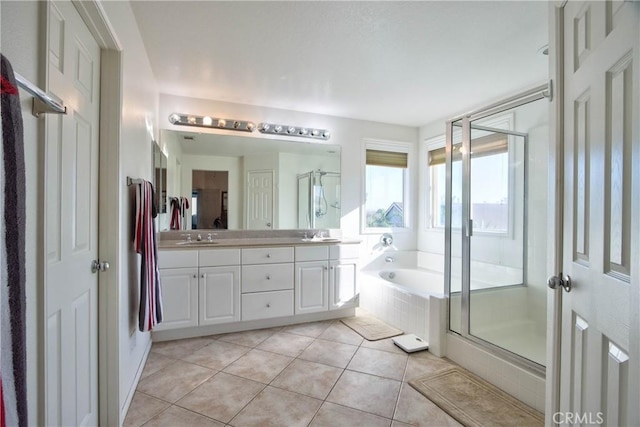 bathroom with tile patterned flooring, vanity, and separate shower and tub