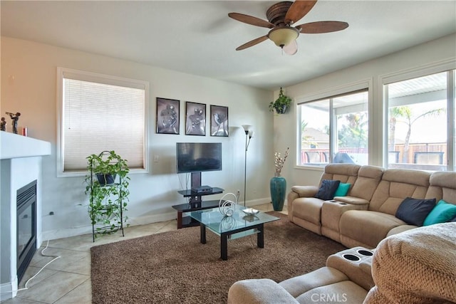 tiled living room with ceiling fan