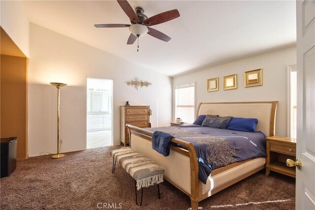 carpeted bedroom featuring vaulted ceiling and ceiling fan