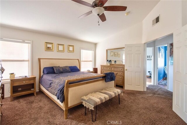 bedroom featuring carpet flooring, multiple windows, ceiling fan, and lofted ceiling