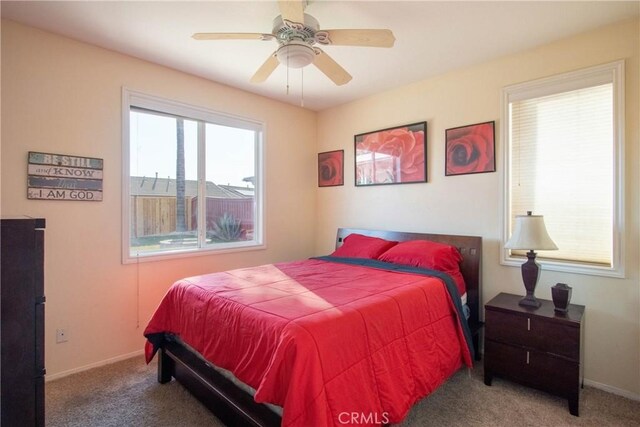 bedroom with ceiling fan and carpet