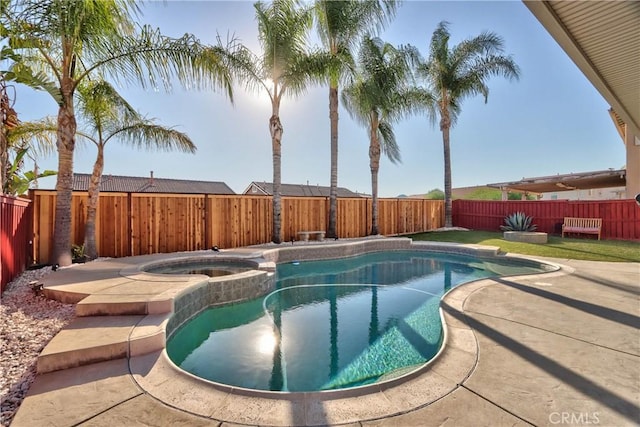 view of pool with an in ground hot tub and a patio