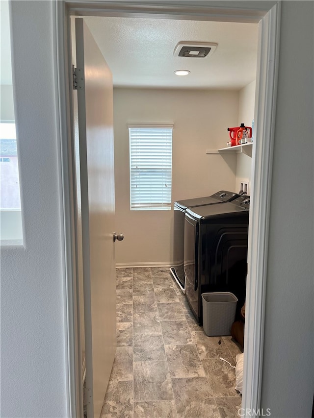 laundry room with washing machine and dryer