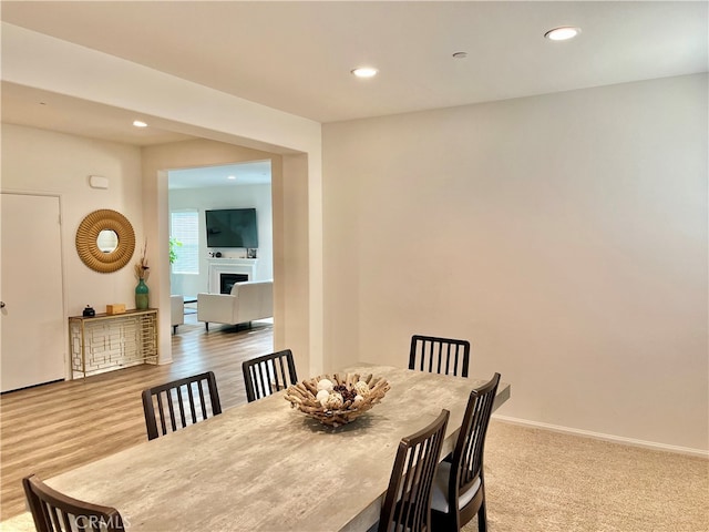 dining area with light hardwood / wood-style floors