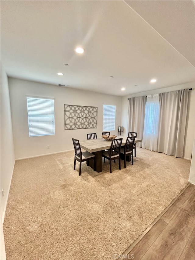 dining area with hardwood / wood-style flooring