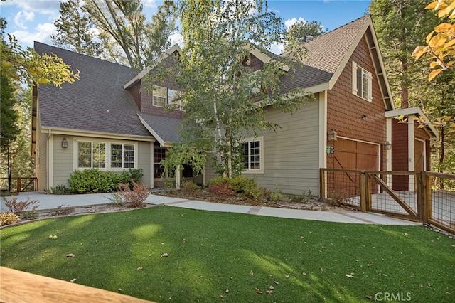 rear view of house featuring a lawn