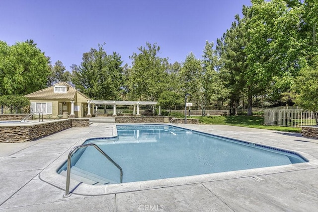 view of swimming pool featuring a patio area