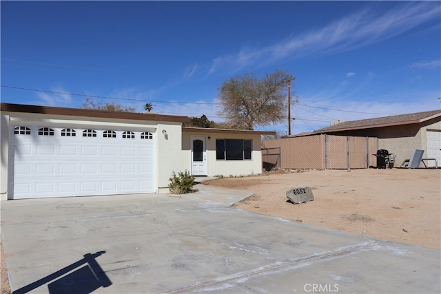 single story home with a garage