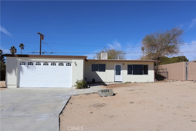 single story home featuring a garage