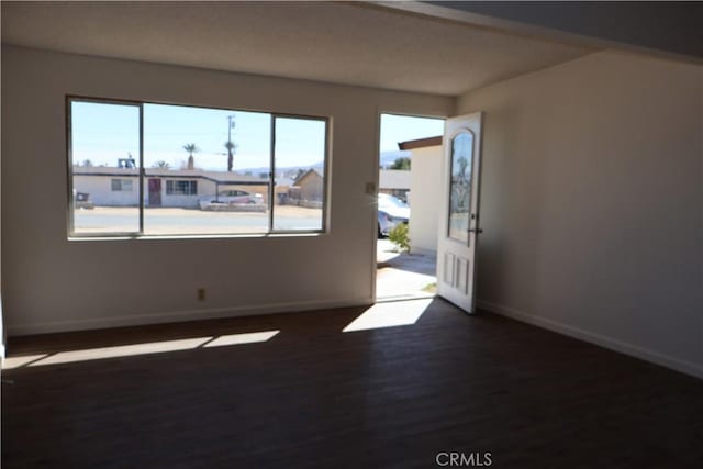 6052 Chia Ave Unit 29, Palms, CA 92277 - entrance foyer featuring baseboards and dark wood finished floors