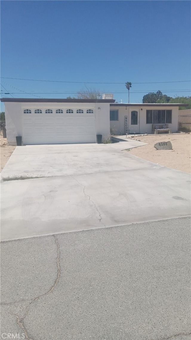 6052 Chia Ave Unit 29, Palms, CA 92277 - view of front of house featuring a garage