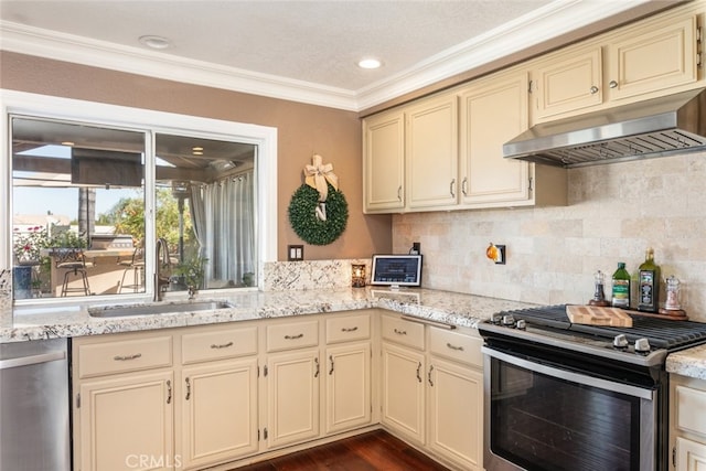 kitchen with stainless steel appliances and cream cabinets